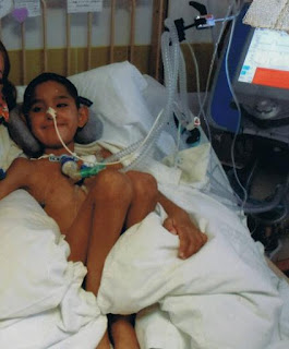 young boy in hospital with ventilator
