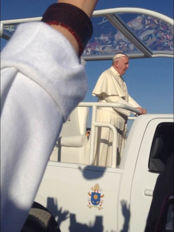 One of our youth took this photo of Pope Francis as he rode by in his popemobile.