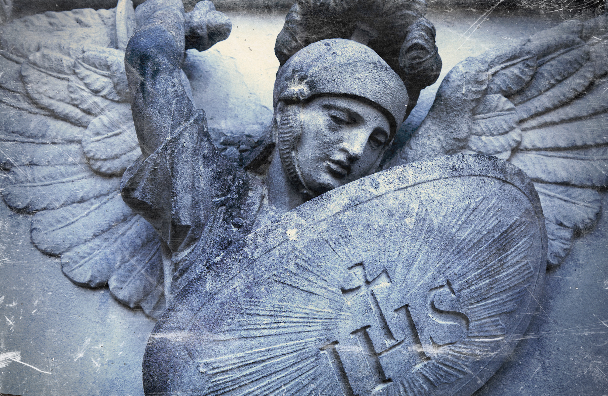 Saint Michael struggles with evil. Fragment of antique statue.