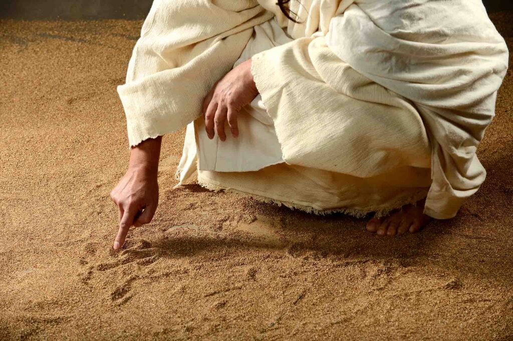 Jesus writing in the sand. 