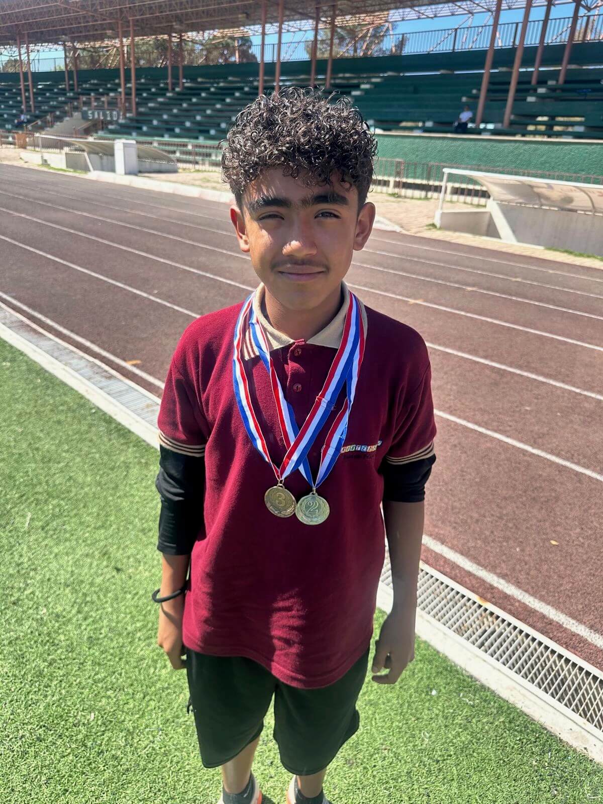 Ezequiel pictured with his medals.