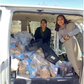 girls in van with food to deliver